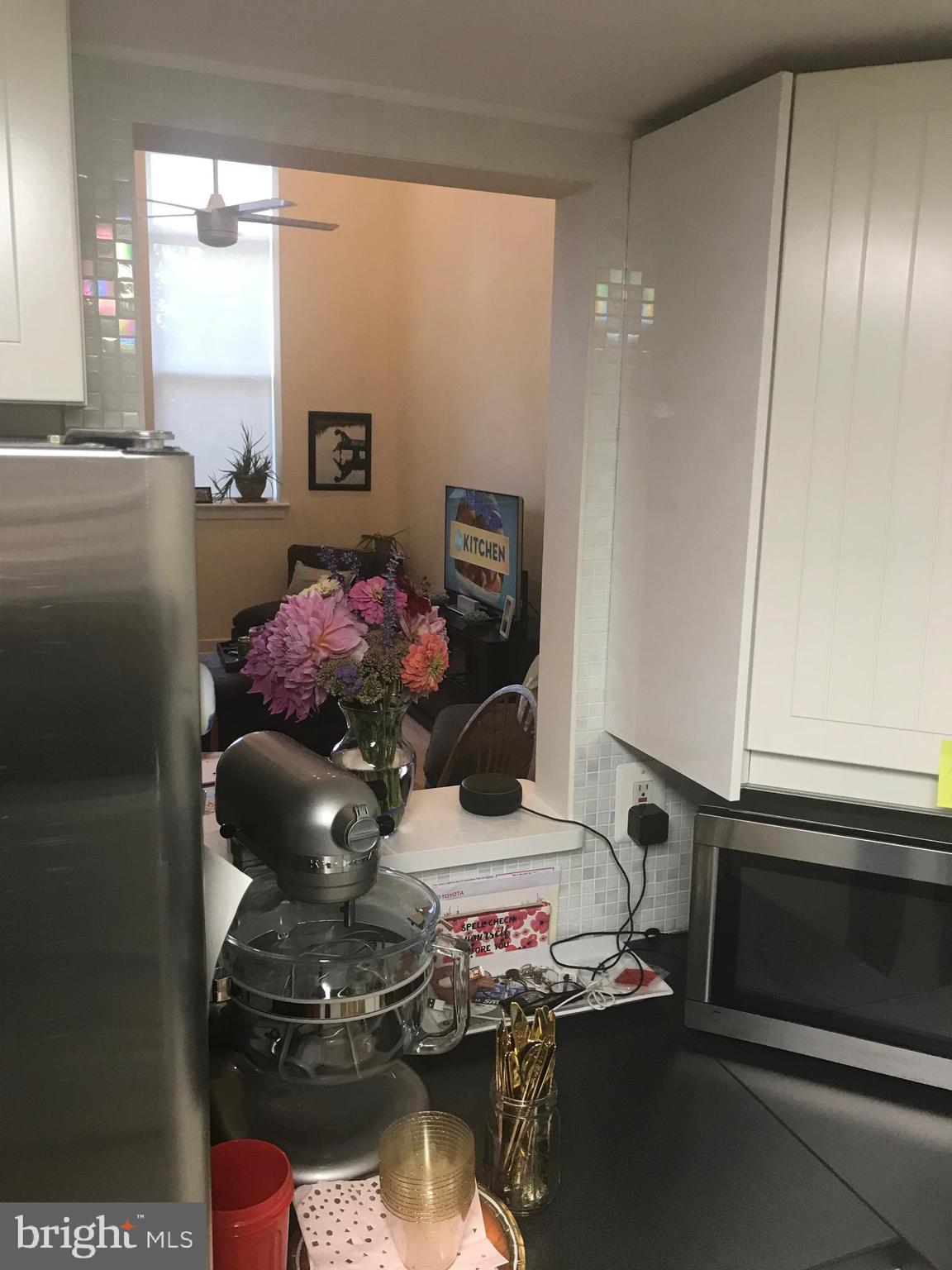 9006 Opera Alley Manassas, VA 20110 - Photo 13 of 19 Cut out from the kitchen to the living room