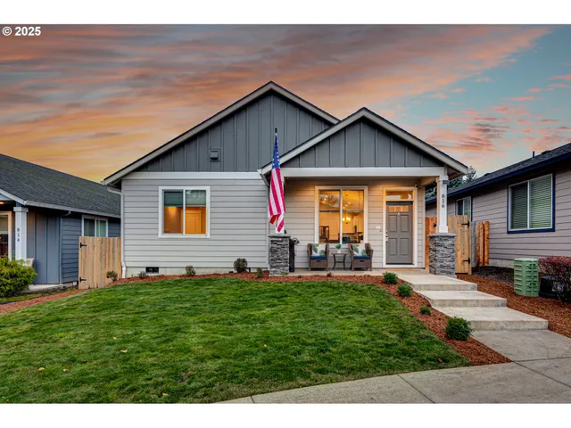 a front view of house with yard and green space