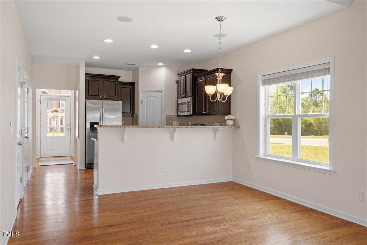 632 Hunters Ridge Drive Fuquay-Varina, NC 27526 - Photo 14 of 28 wooden floor in an empty room with a window