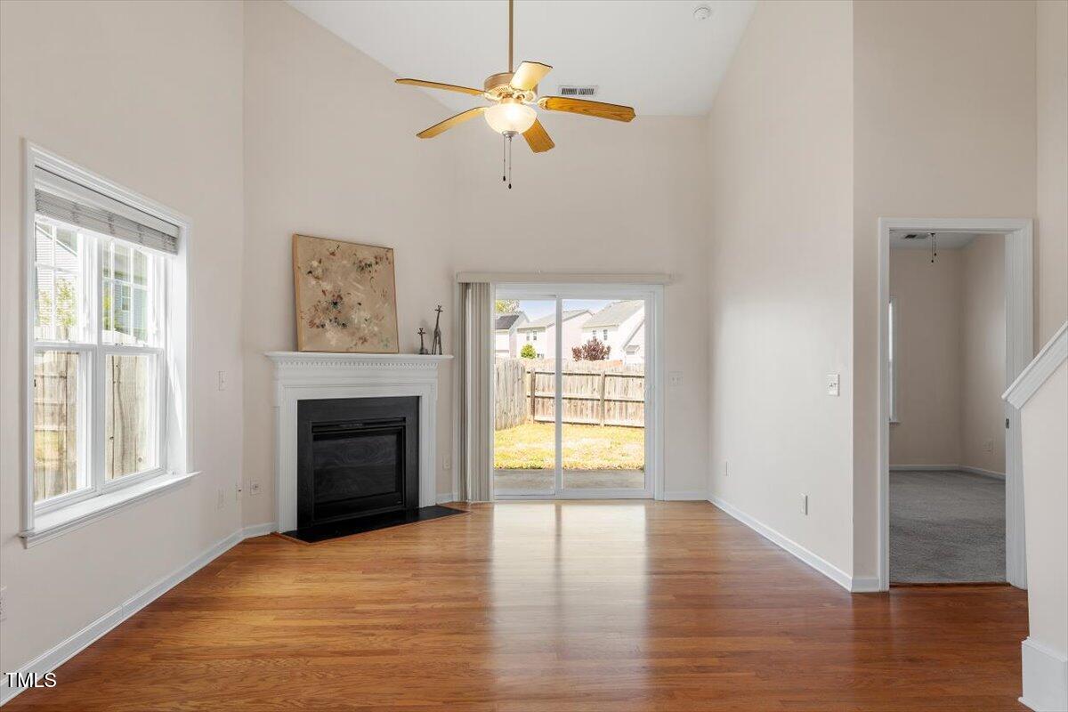632 Hunters Ridge Drive Fuquay-Varina, NC 27526 - Photo 15 of 28 a view of an empty room with a window and fireplace