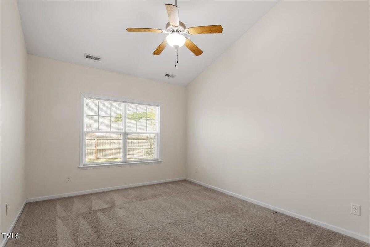 632 Hunters Ridge Drive Fuquay-Varina, NC 27526 - Photo 19 of 28 an empty room with windows and fan