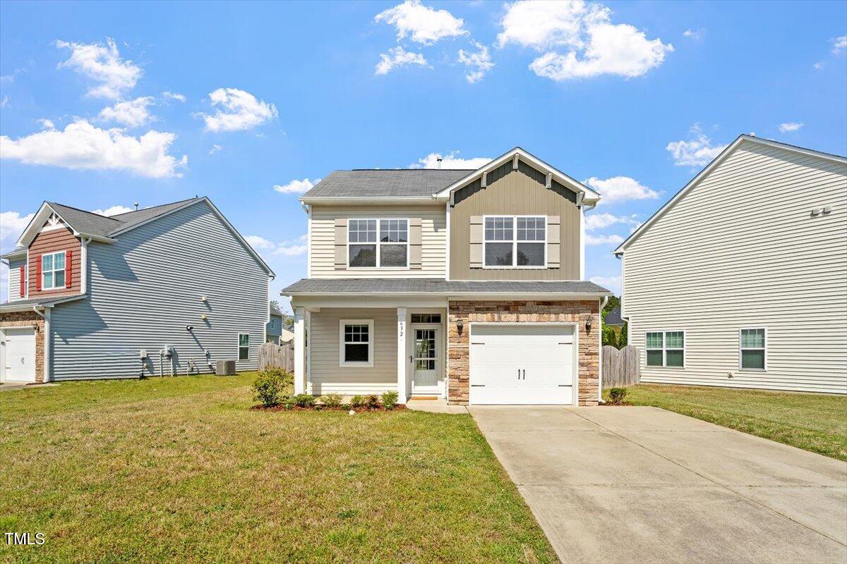 632 Hunters Ridge Drive Fuquay-Varina, NC 27526 - Photo 2 of 28 a front view of a house with yard