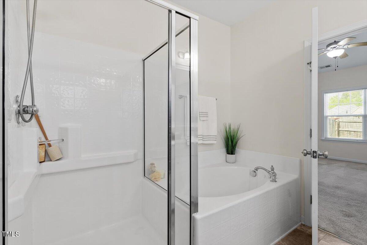 632 Hunters Ridge Drive Fuquay-Varina, NC 27526 - Photo 23 of 28 a bathroom with a bathtub and a shower