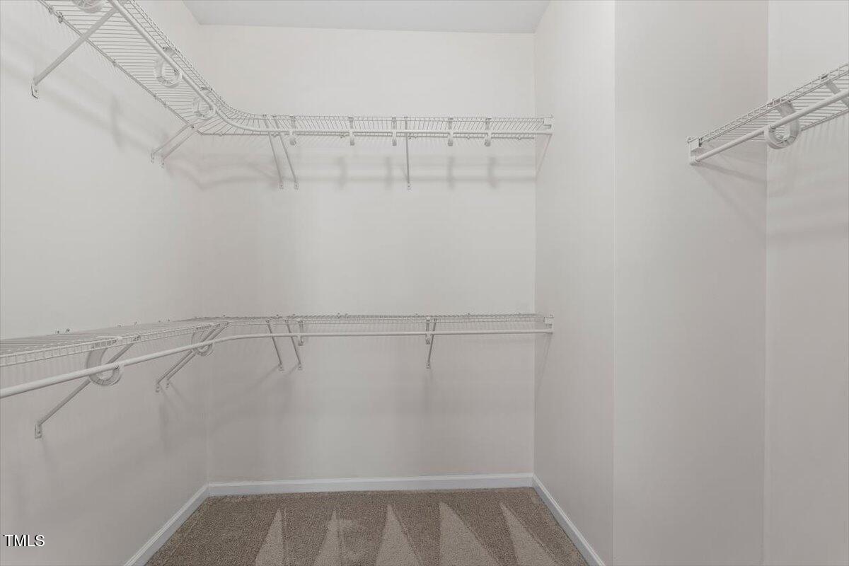 632 Hunters Ridge Drive Fuquay-Varina, NC 27526 - Photo 24 of 28 a view of a room with racks on the wall