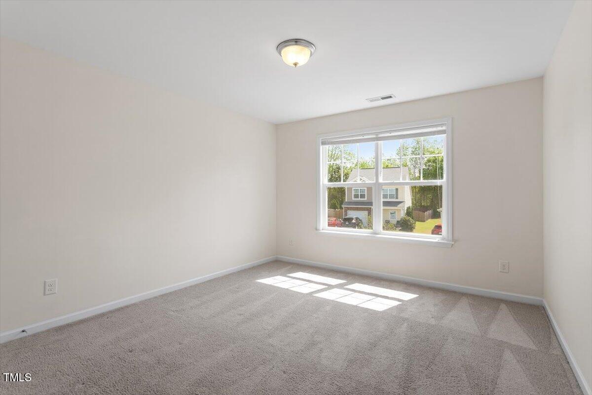 632 Hunters Ridge Drive Fuquay-Varina, NC 27526 - Photo 27 of 28 an empty room with a window
