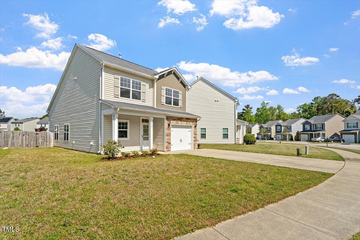 632 Hunters Ridge Drive Fuquay-Varina, NC 27526 - Photo 3 of 28 a front view of a house with a yard