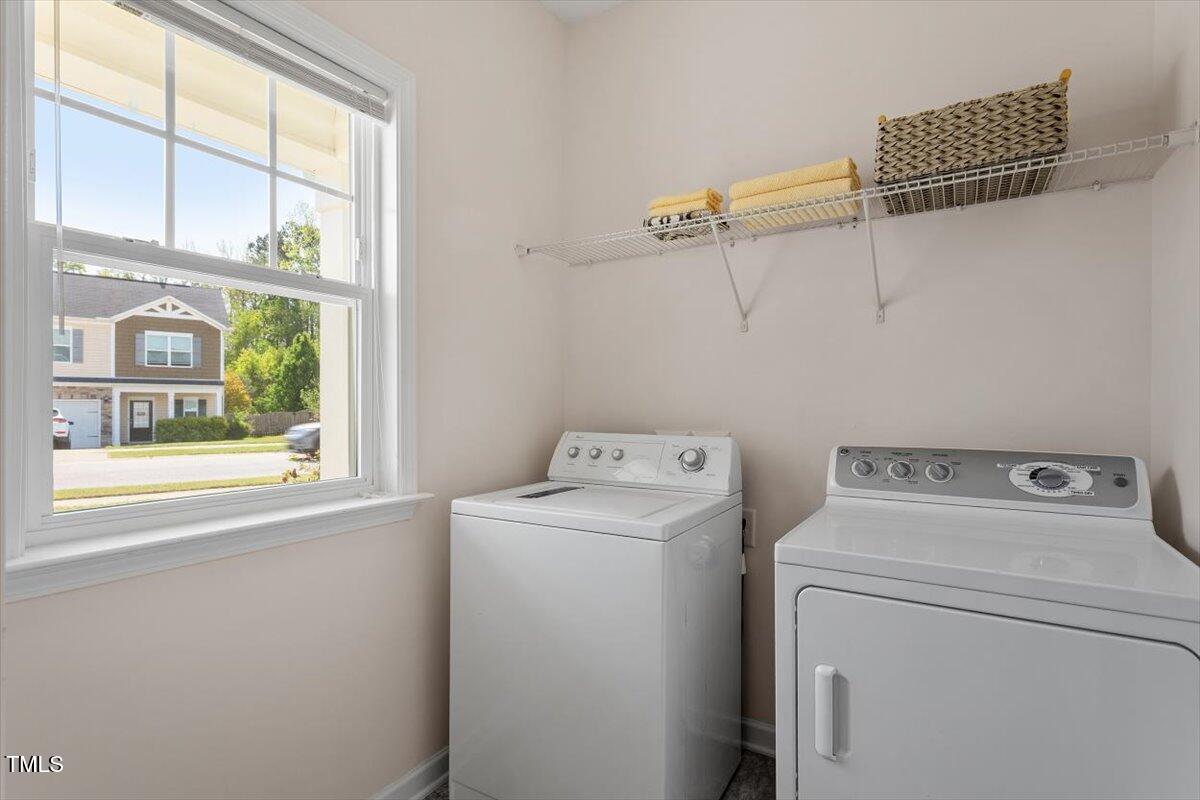 632 Hunters Ridge Drive Fuquay-Varina, NC 27526 - Photo 7 of 28 a view of storage and utility room with washer and dryer