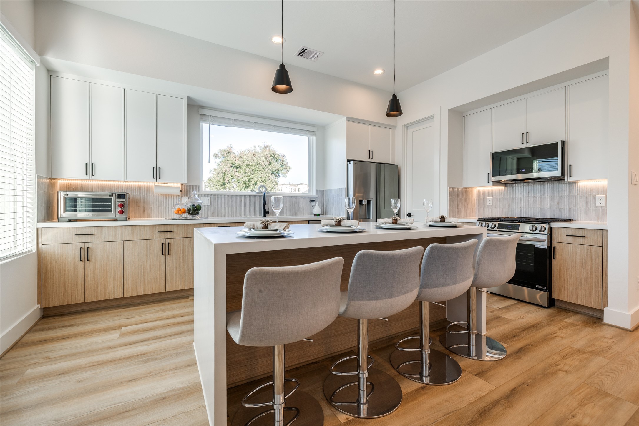 412 North Nagle Street Houston, TX 77003 - Photo 13 of 40 a kitchen with a sink cabinets and window