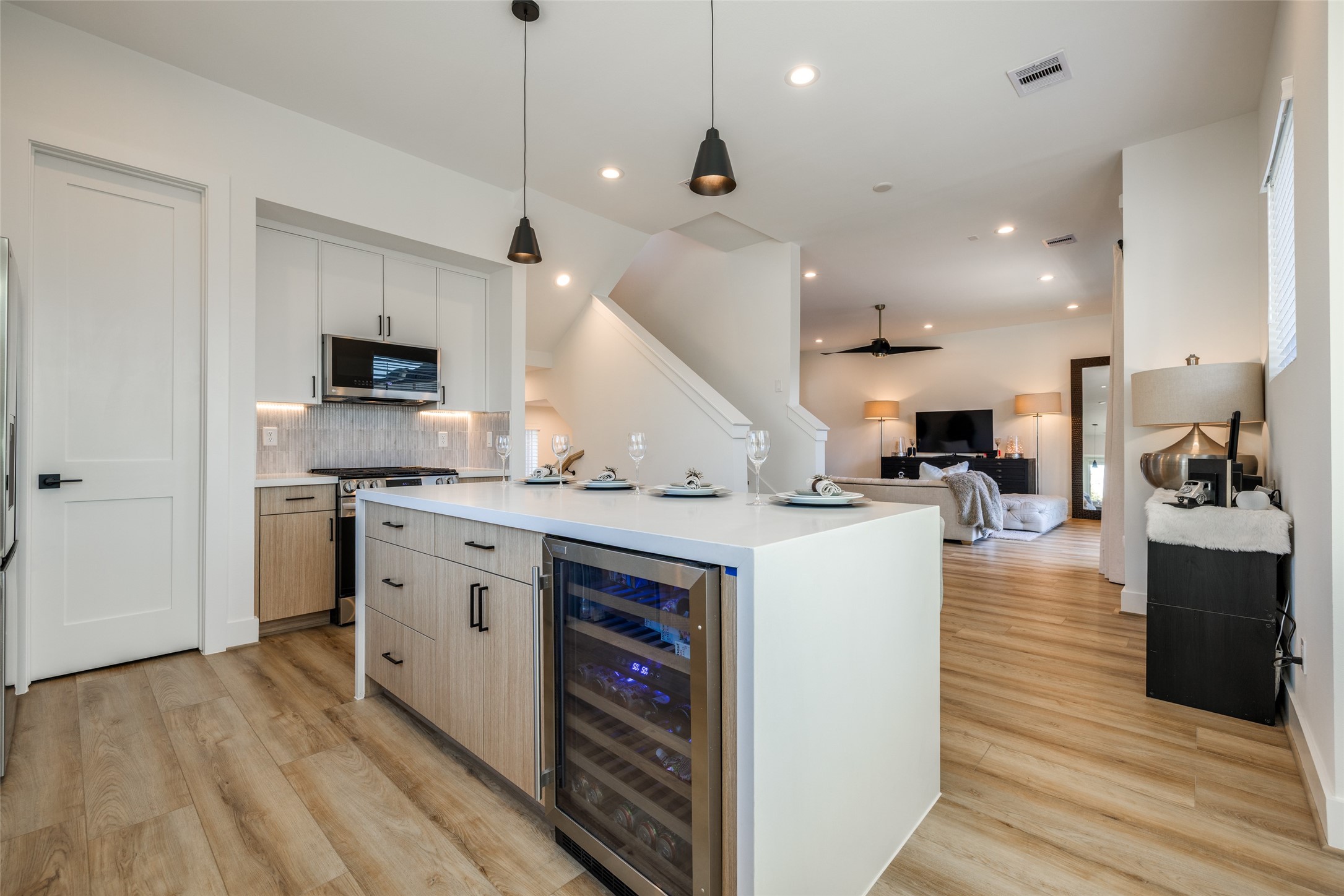412 North Nagle Street Houston, TX 77003 - Photo 18 of 40 a kitchen with kitchen island a stove a sink and a refrigerator