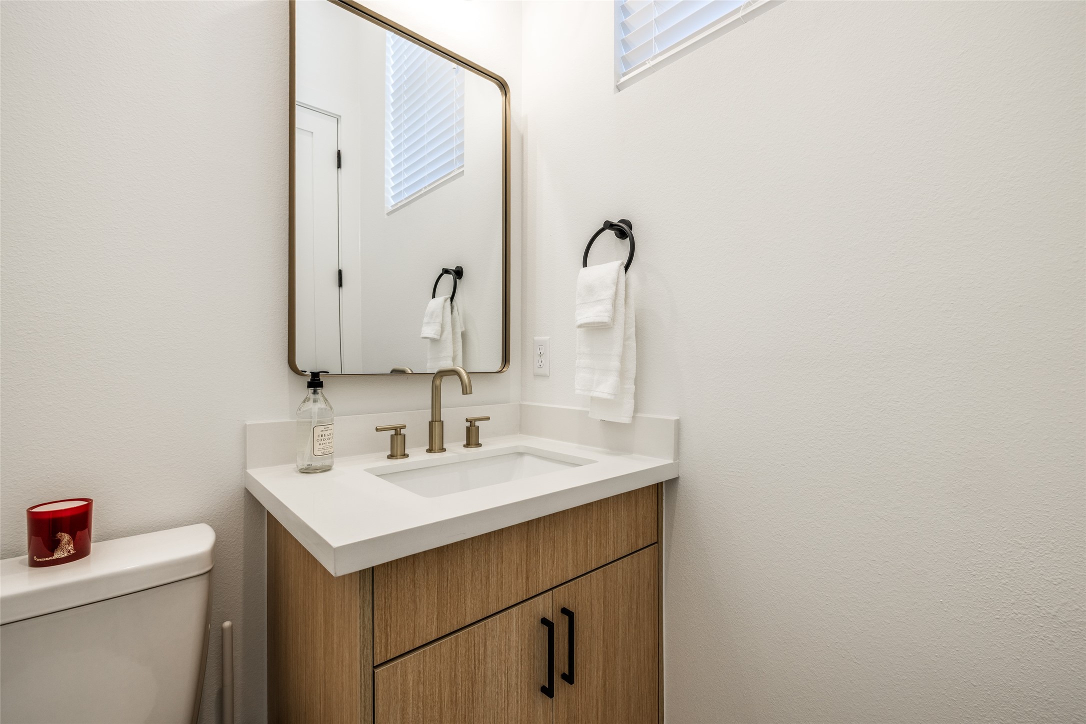412 North Nagle Street Houston, TX 77003 - Photo 23 of 40 a bathroom with a sink and a mirror