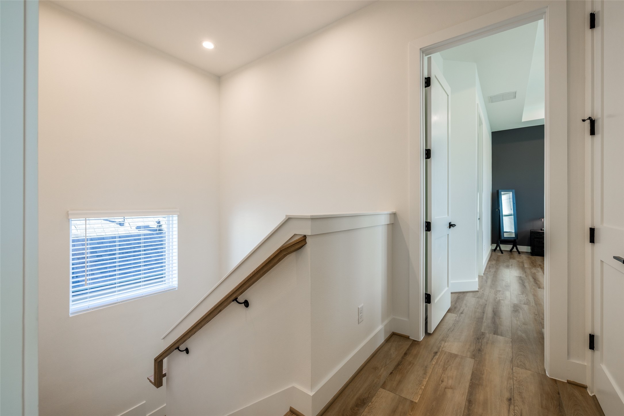 412 North Nagle Street Houston, TX 77003 - Photo 25 of 40 a view of a hallway with wooden floor and staircase
