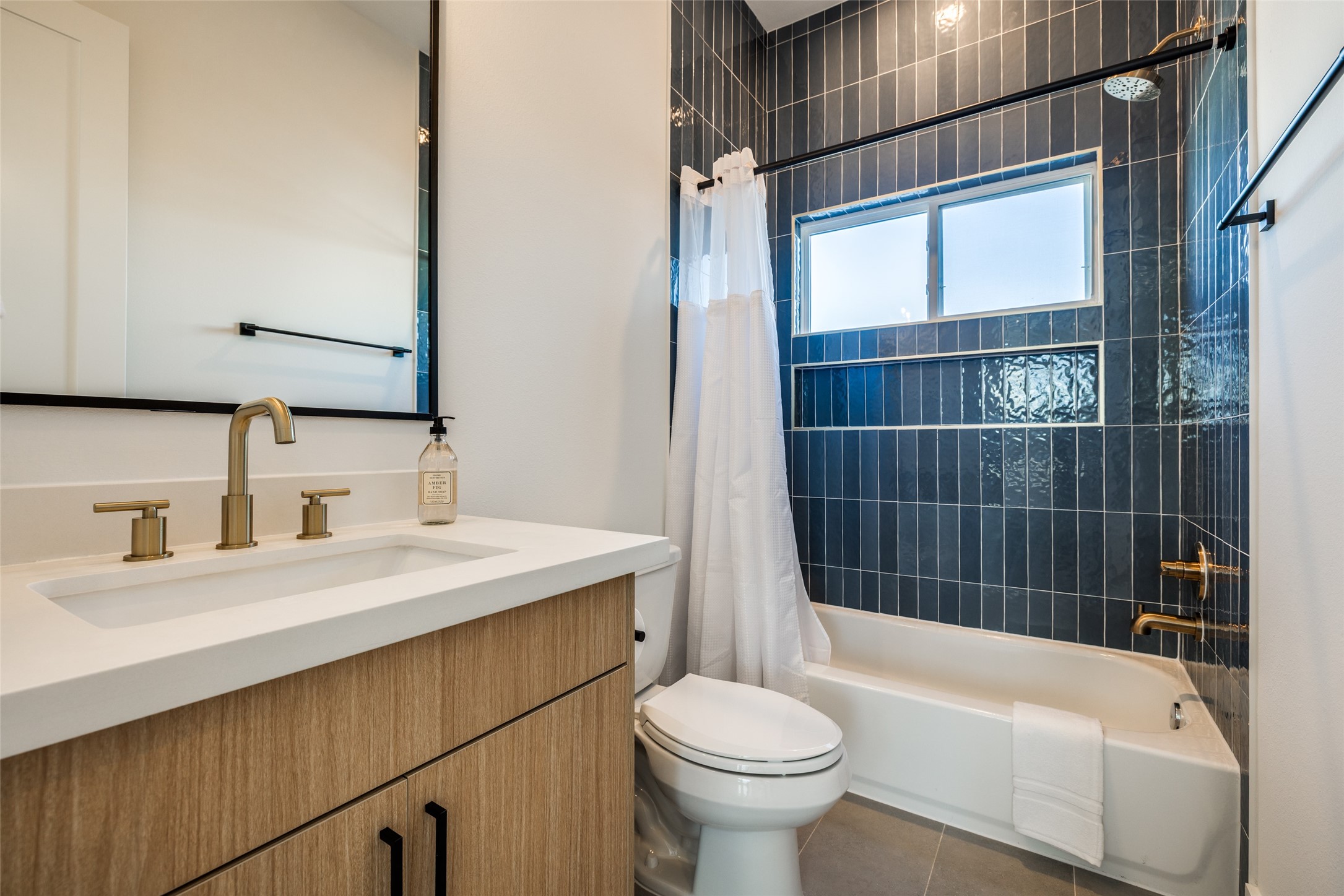 412 North Nagle Street Houston, TX 77003 - Photo 28 of 40 a bathroom with a sink a toilet a mirror and shower