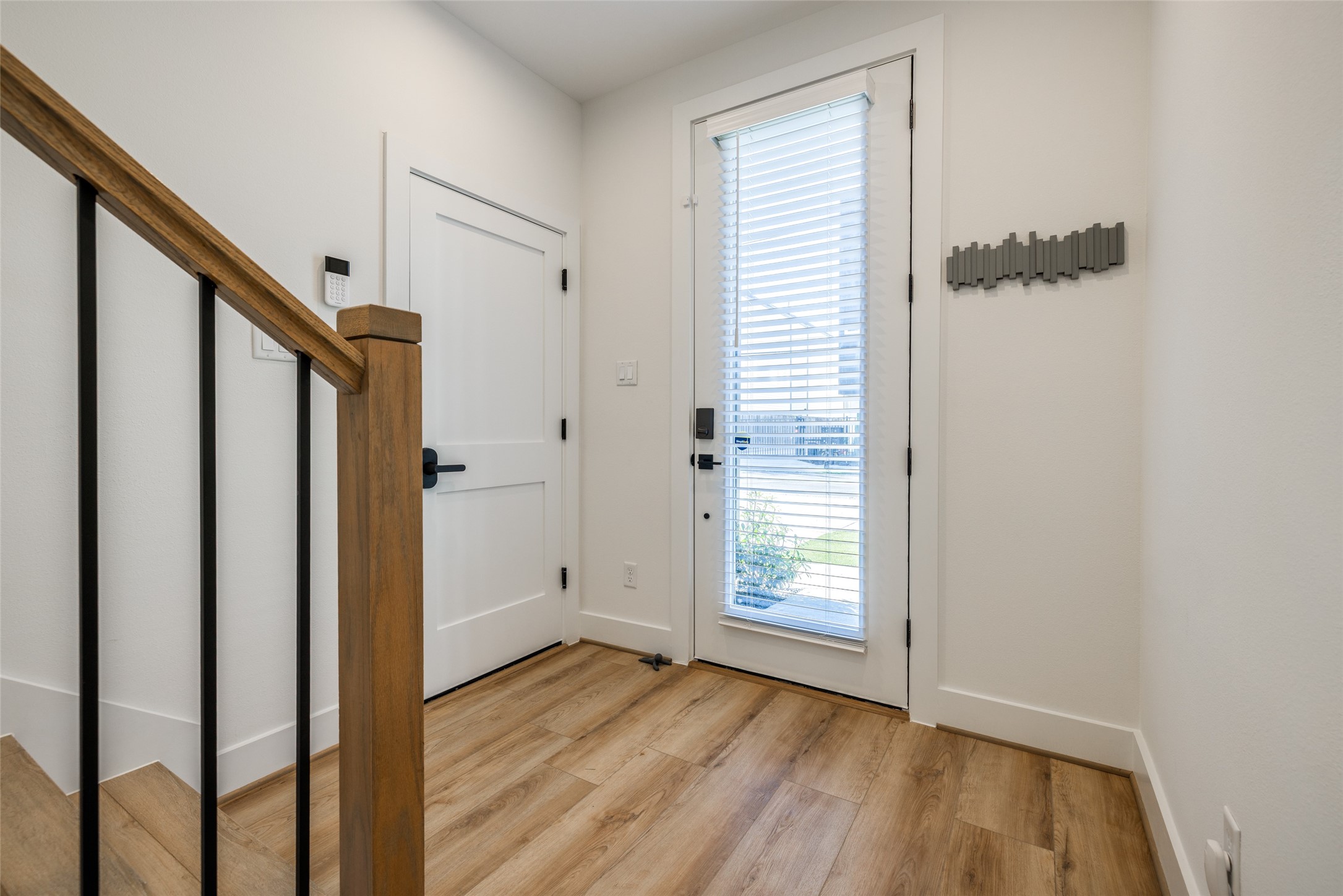 412 North Nagle Street Houston, TX 77003 - Photo 3 of 40 an empty room with wooden floor and entryway