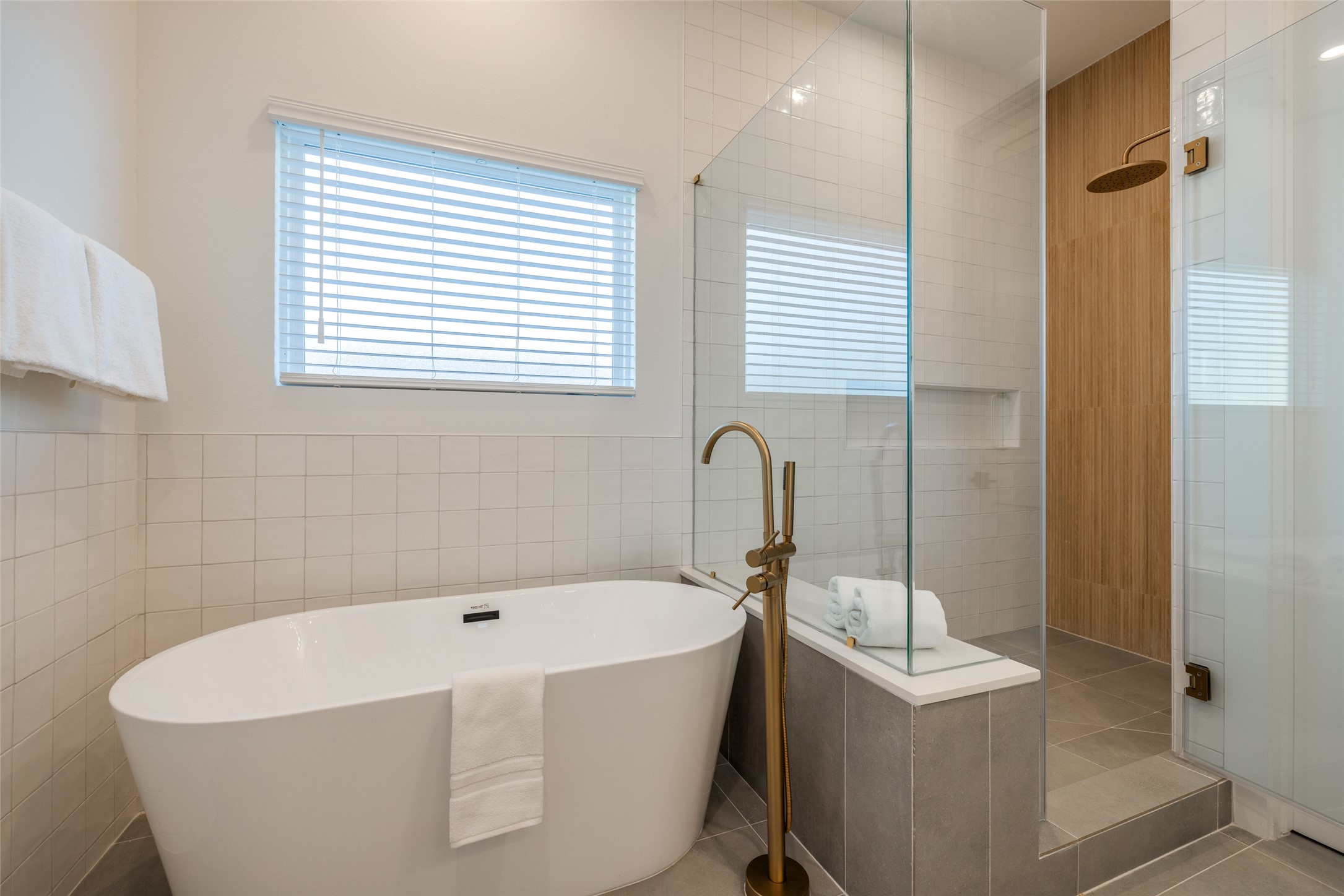 412 North Nagle Street Houston, TX 77003 - Photo 32 of 40 a white bath tub sitting in a bathroom next to a window