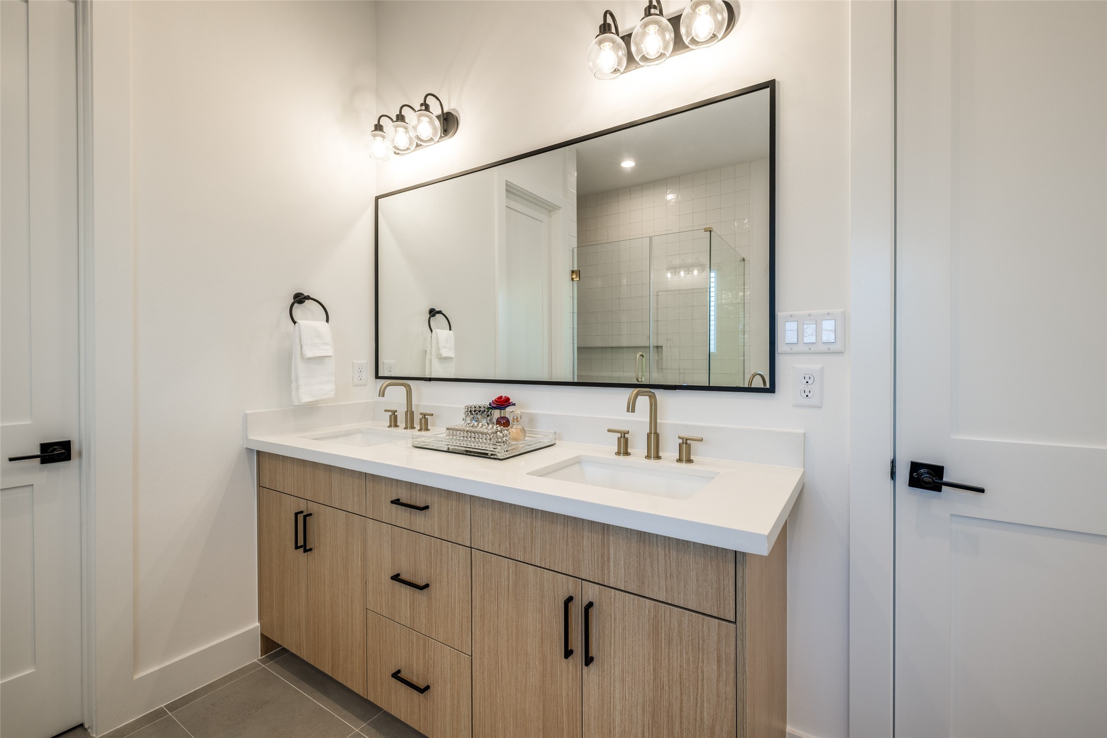 412 North Nagle Street Houston, TX 77003 - Photo 34 of 40 a bathroom with a double vanity sink and mirror