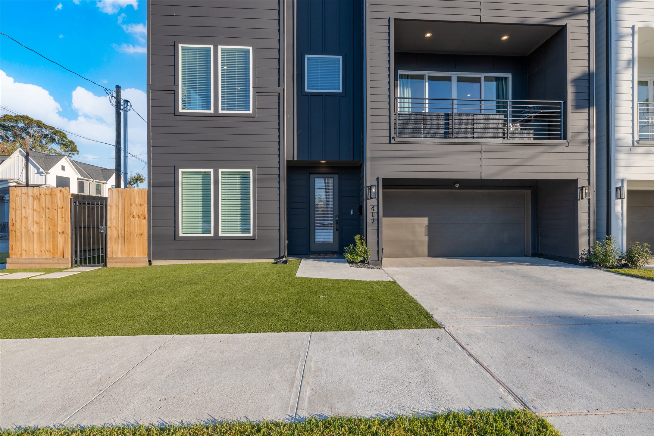412 North Nagle Street Houston, TX 77003 - Photo 35 of 40 a front view of a house with a garden and yard