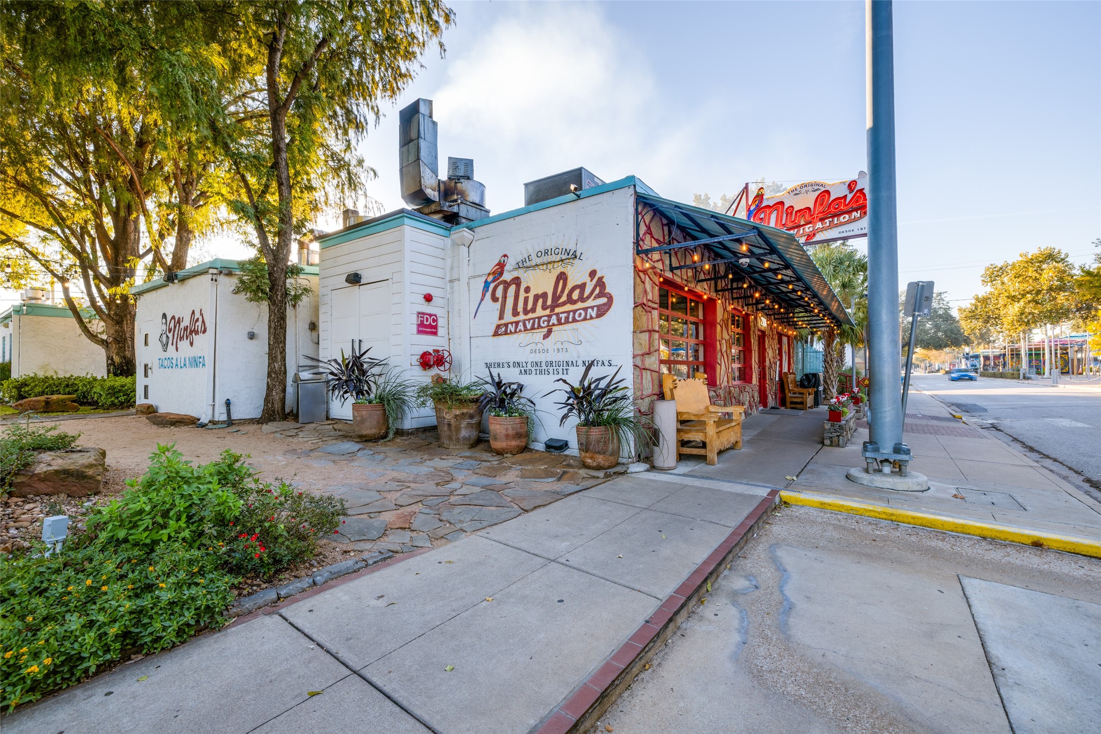 412 North Nagle Street Houston, TX 77003 - Photo 36 of 40 a view of a park with potted plants and a bench