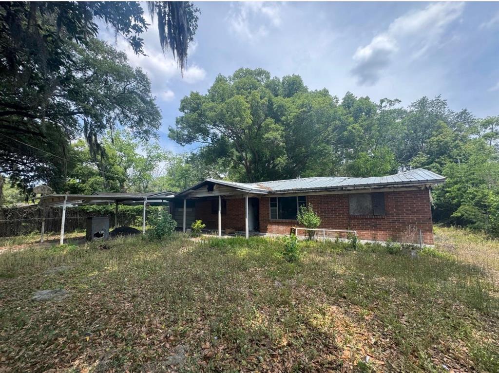 8321 Old Plank Road Jacksonville, FL 32220 - Photo 3 of 8 a backyard of a house with lots of green space