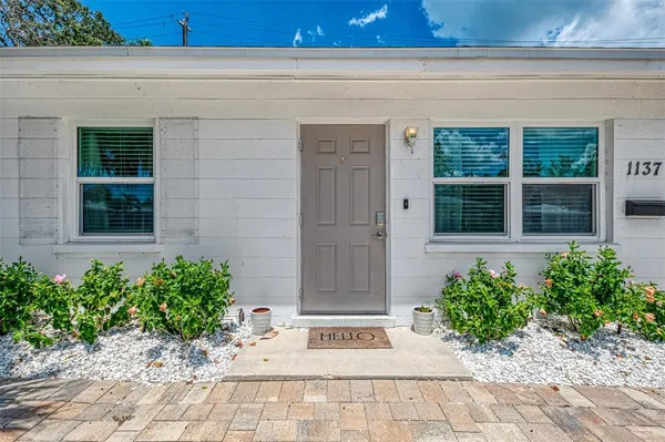 a view of a entryway door front of a house