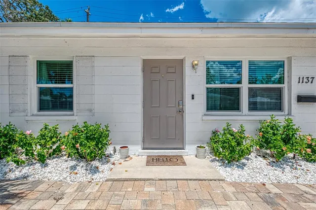 a view of a entryway door front of a house