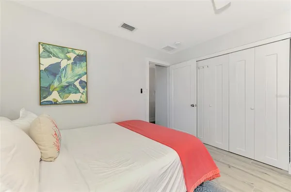 a view of a house with backyard and wooden door