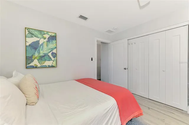 a view of a house with backyard and wooden door