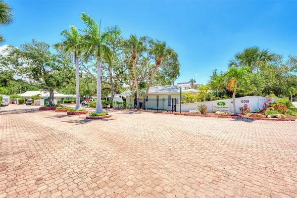 a view of a balcony with wooden floor and seating space