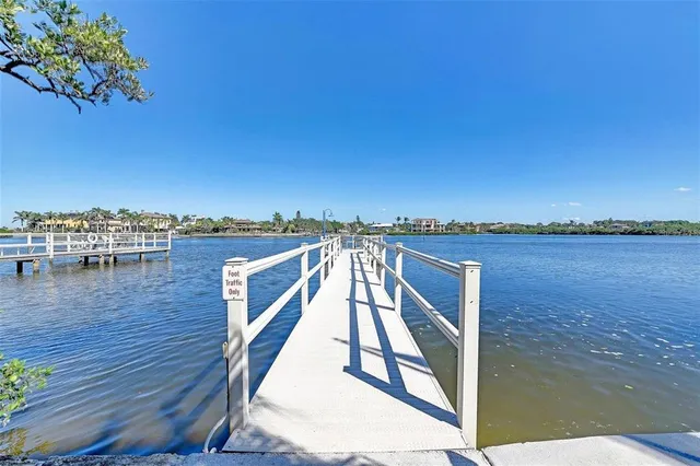 a view of a cars park in front of a building