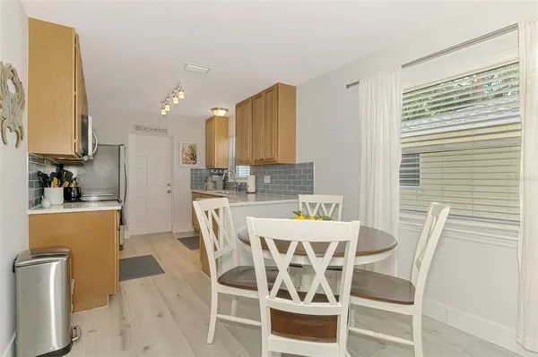 a view of a dining room with furniture and a window