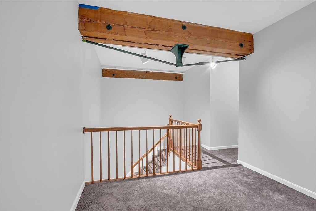200 Market Street, Unit 117 Lowell, MA 01852 - Photo 13 of 37 a view of a hallway with a fan