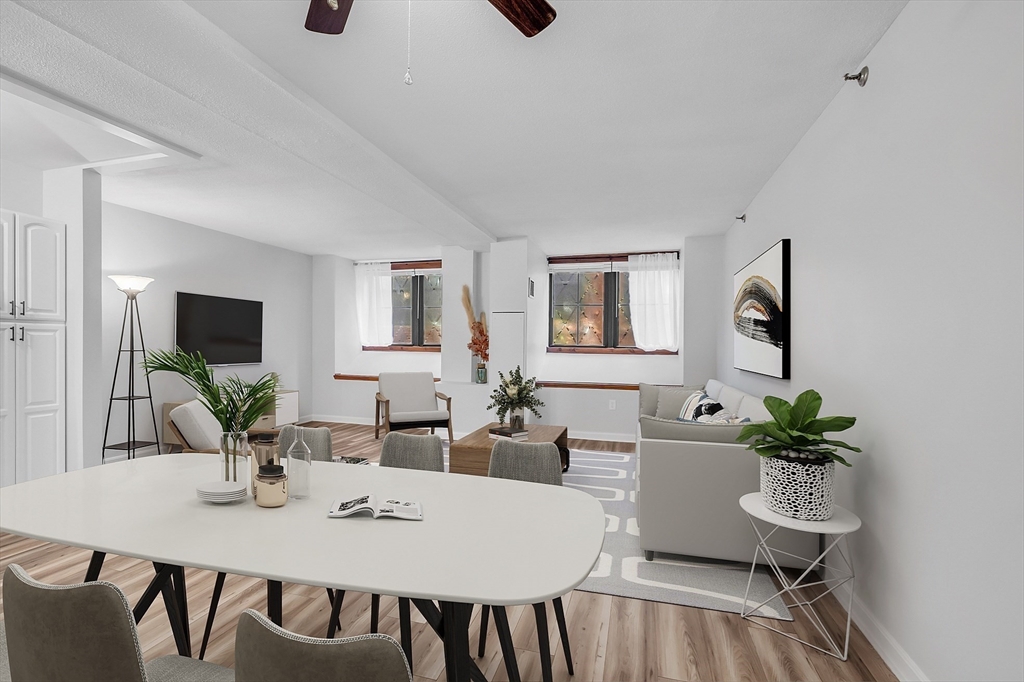 200 Market Street, Unit 117 Lowell, MA 01852 - Photo 5 of 37 a view of a dining room with furniture and wooden floor