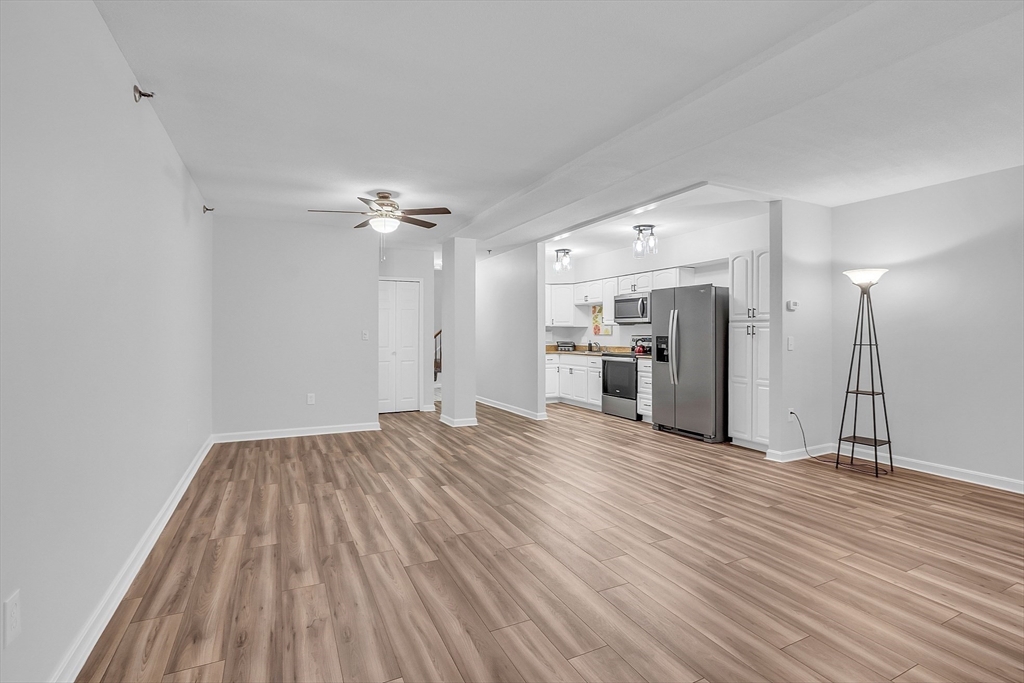 200 Market Street, Unit 117 Lowell, MA 01852 - Photo 7 of 37 a view of an empty room and wooden floor