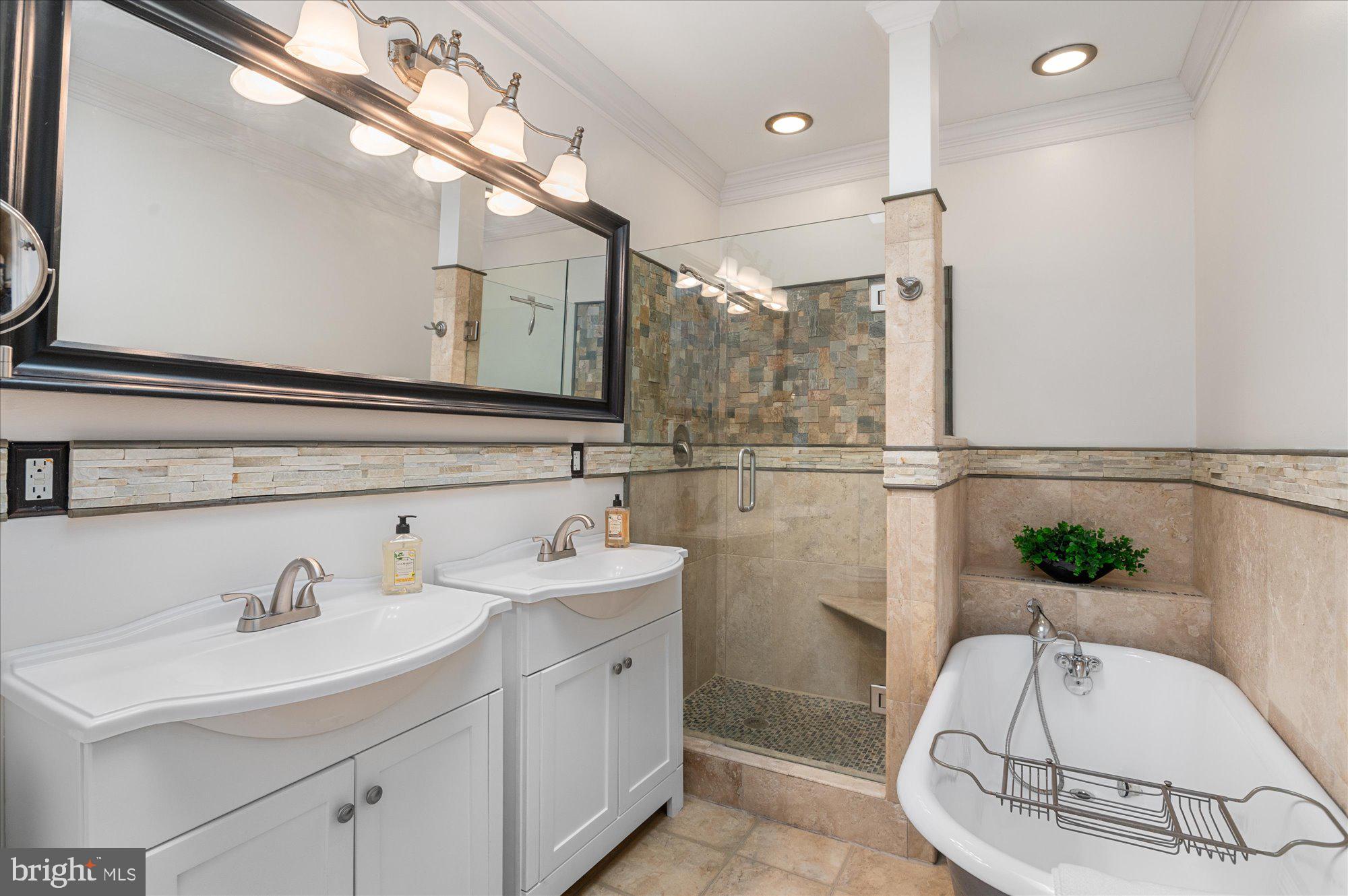 1309 Spring Road Northwest Washington, DC 20010 - Photo 15 of 22 a bathroom with a sink and a mirror