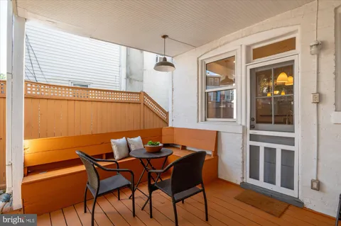 a view of a dining room with furniture and window