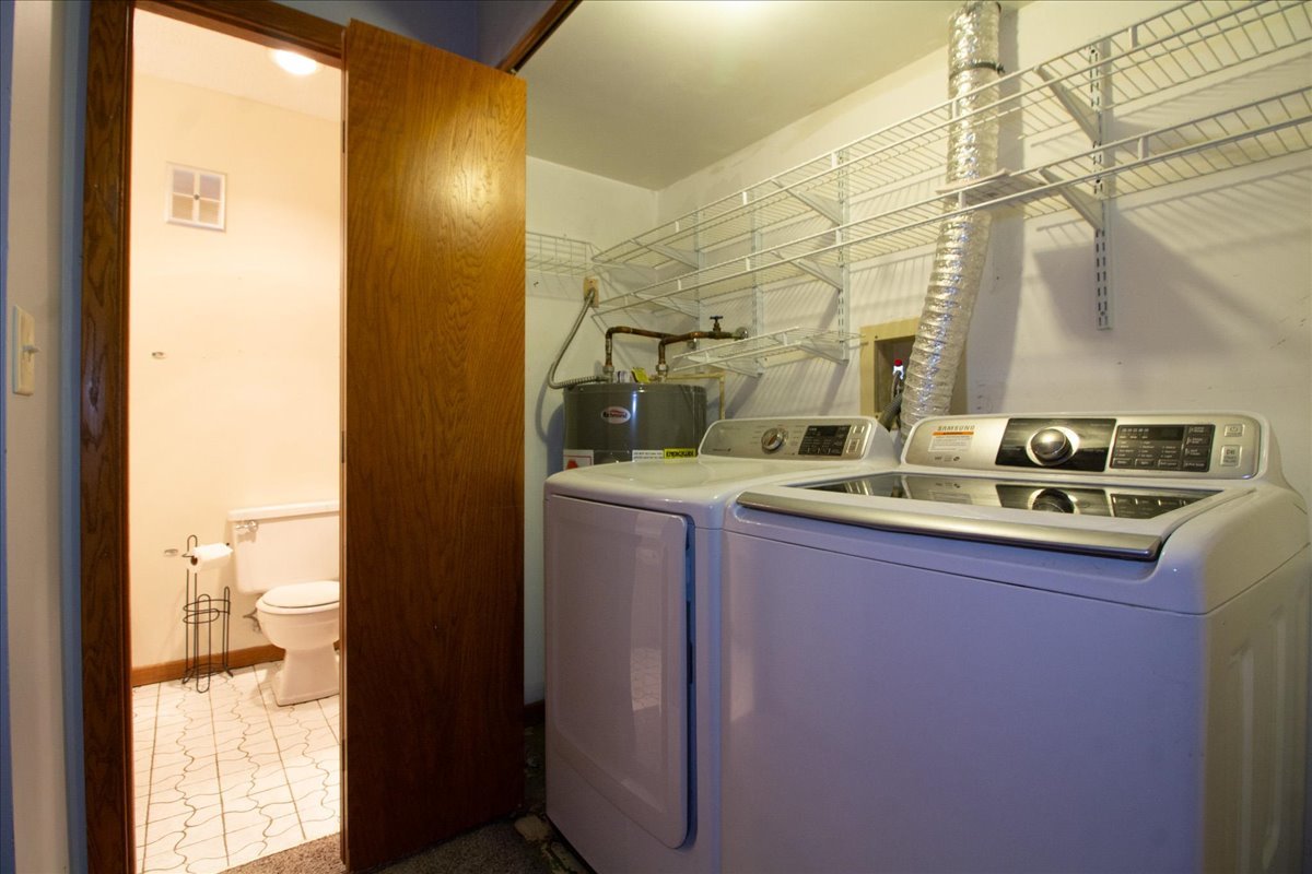 1424 Woodbridge Road, Unit 2C Joliet, IL 60436 - Photo 16 of 20 a bathroom with a sink and a mirror