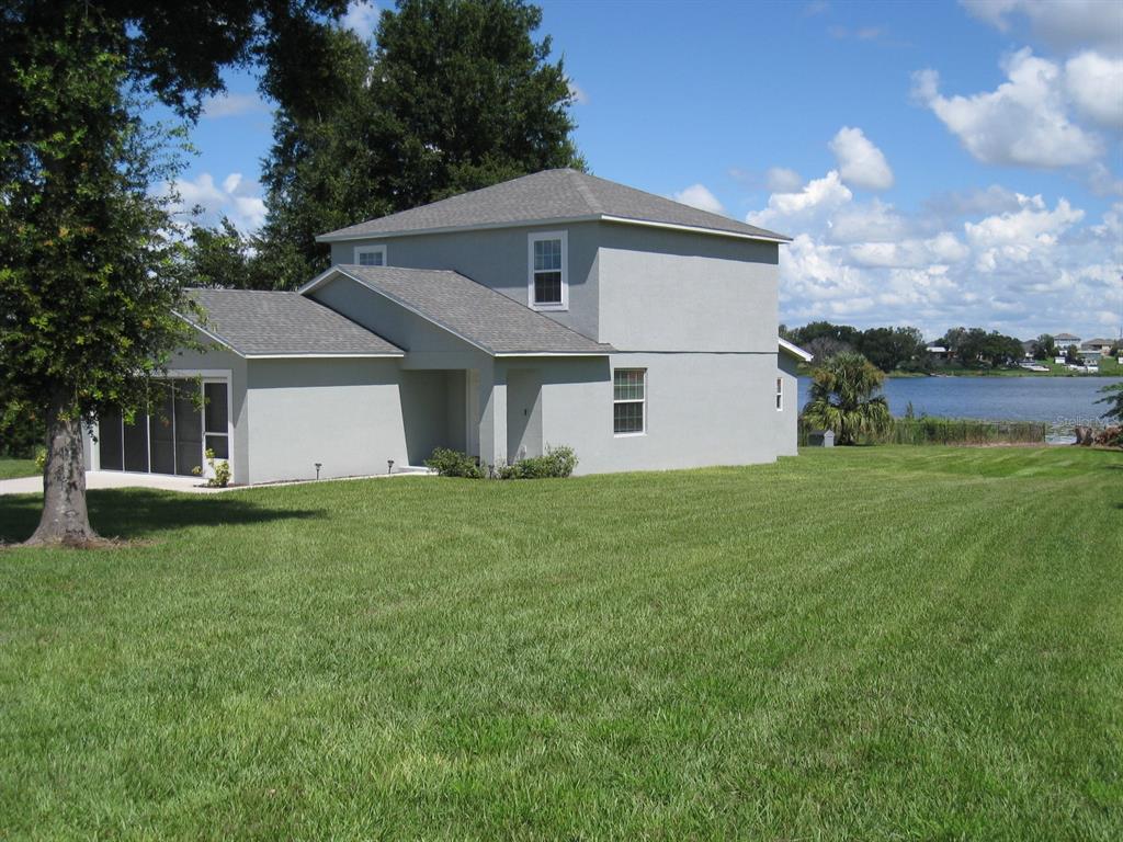 1300 Lucerne Loop Road Northeast Winter Haven, FL 33881 - Photo 37 of 40 Right side of home.