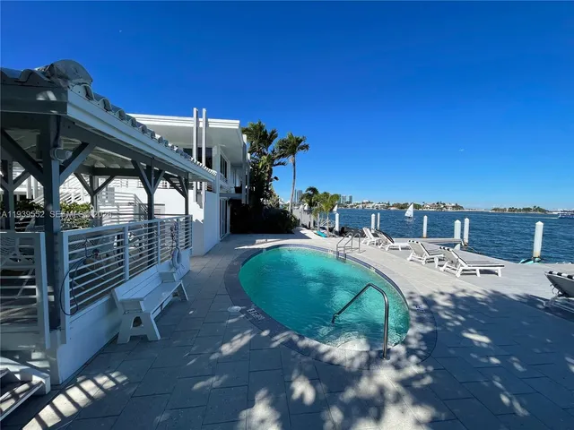 a view of a backyard with a patio