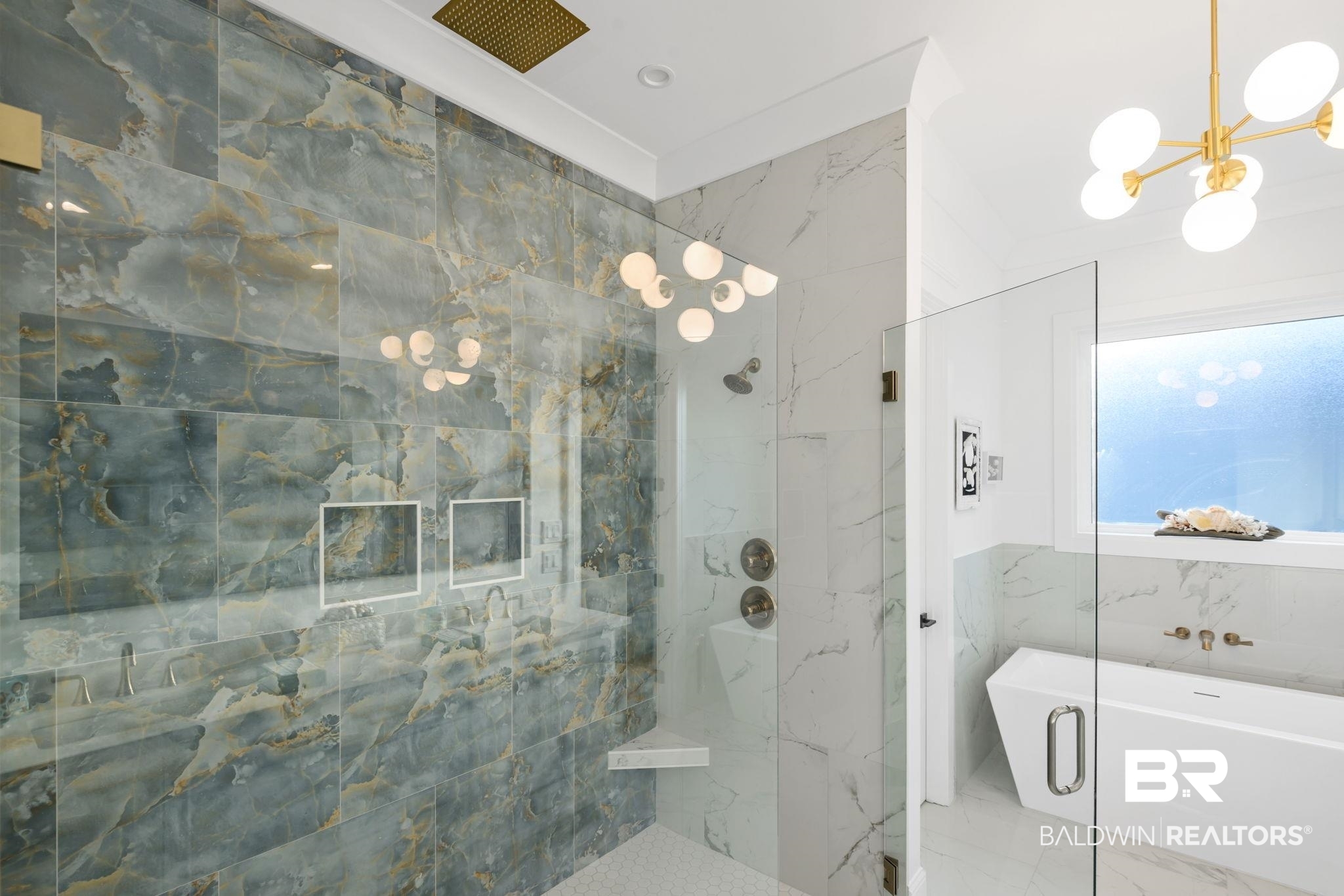 30313 River Road Orange Beach, AL 36561 - Photo 25 of 50 Full bathroom featuring a soaking tub, marble finish flooring, a marble finish shower, a chandelier, and crown molding