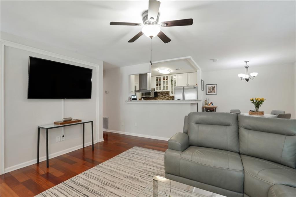 3210 Lake Pointe Circle Roswell, GA 30075 - Photo 14 of 26 a living room with furniture and a flat screen tv
