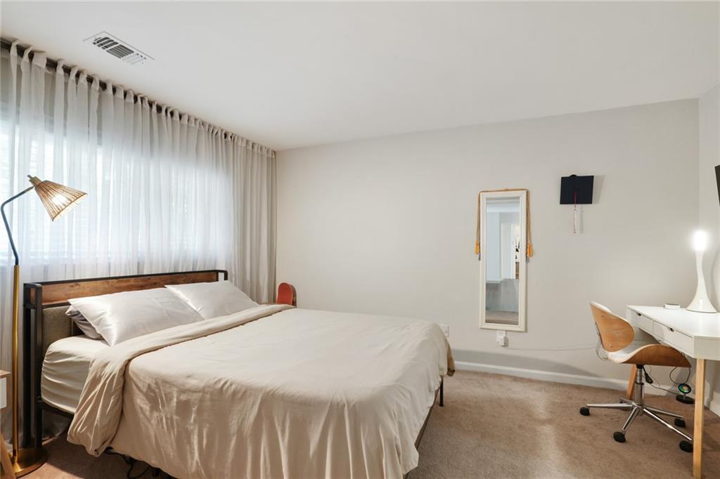 3210 Lake Pointe Circle Roswell, GA 30075 - Photo 19 of 26 a bedroom with a bed and a table in it