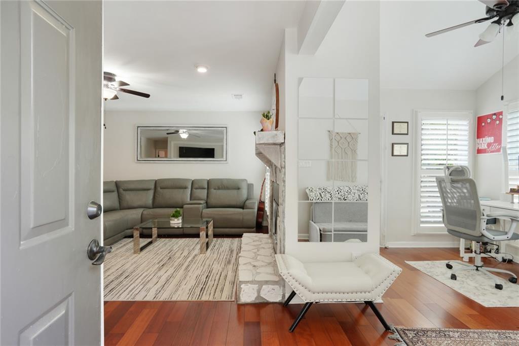 3210 Lake Pointe Circle Roswell, GA 30075 - Photo 2 of 26 a living room with furniture and a flat screen tv
