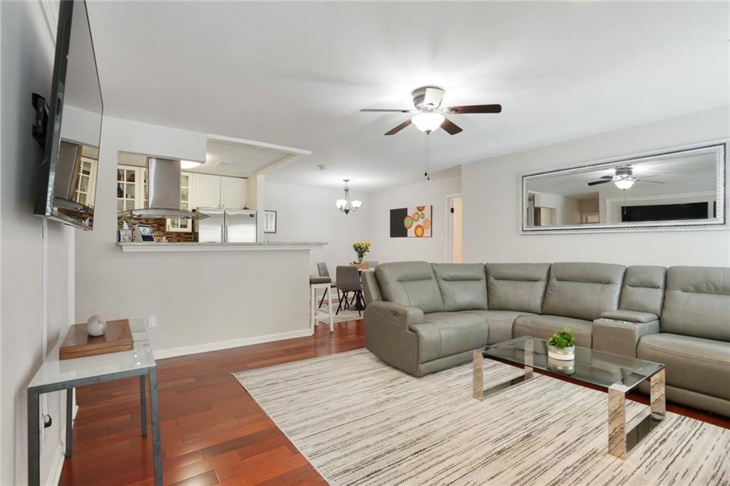 3210 Lake Pointe Circle Roswell, GA 30075 - Photo 3 of 26 a living room with furniture and a flat screen tv