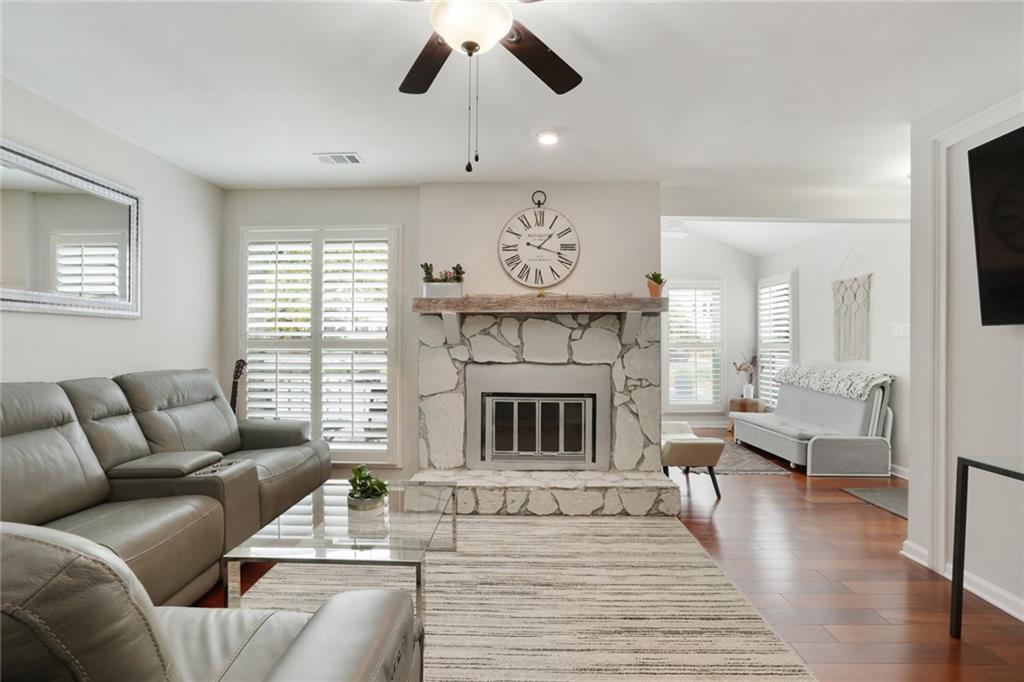 3210 Lake Pointe Circle Roswell, GA 30075 - Photo 5 of 26 a living room with furniture and a fireplace