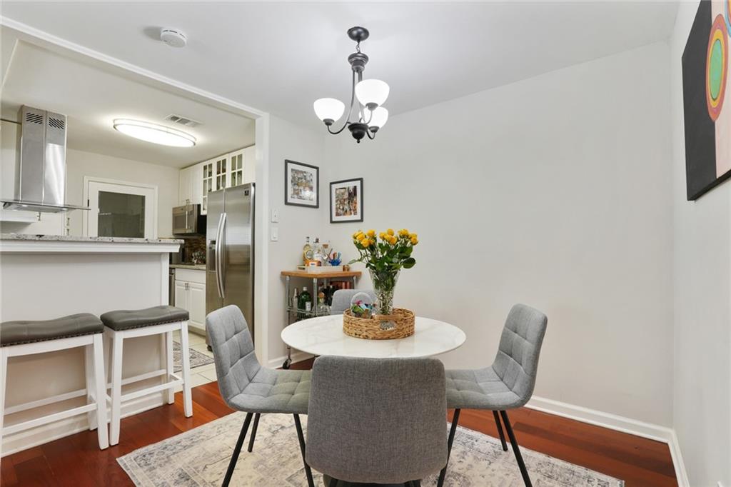 3210 Lake Pointe Circle Roswell, GA 30075 - Photo 10 of 26 a dining room with furniture and window