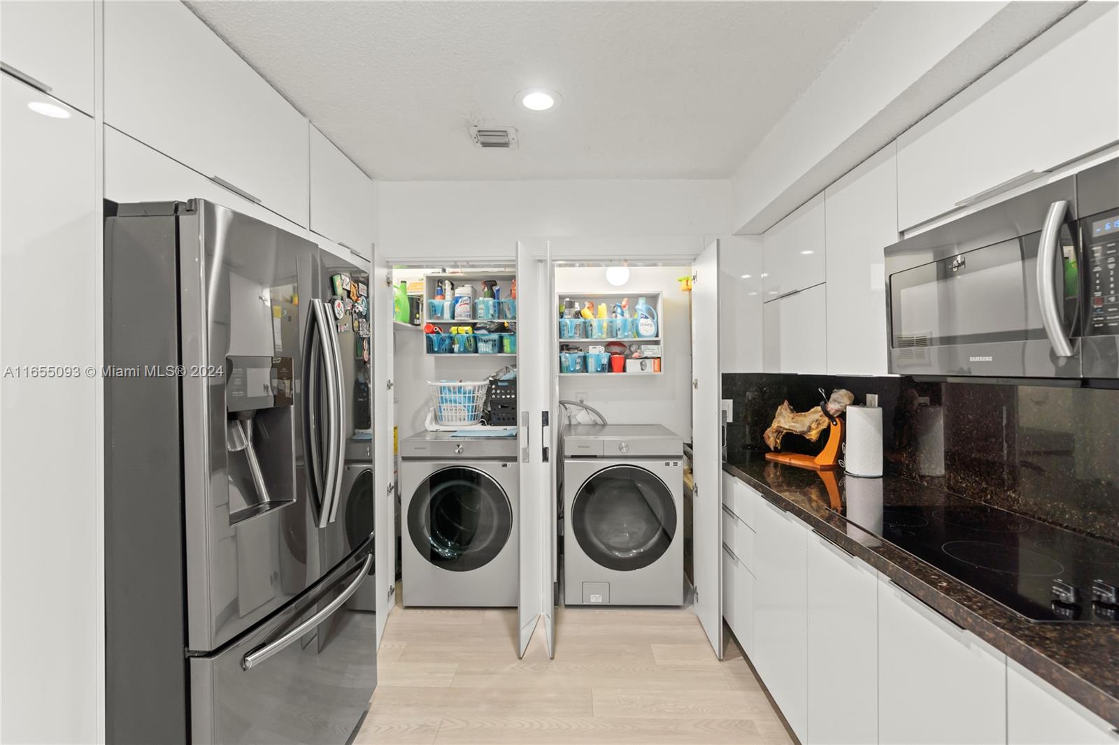 5301 Southwest 126th Terrace, Unit 5301 Miramar, FL 33027 - Photo 14 of 37 a kitchen with stainless steel appliances granite countertop a refrigerator and a stove top oven