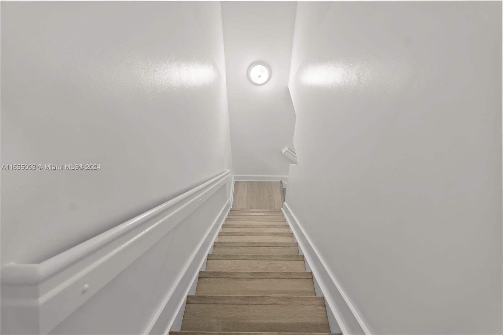 5301 Southwest 126th Terrace, Unit 5301 Miramar, FL 33027 - Photo 17 of 37 a view of a hallway with wooden floor and entryway