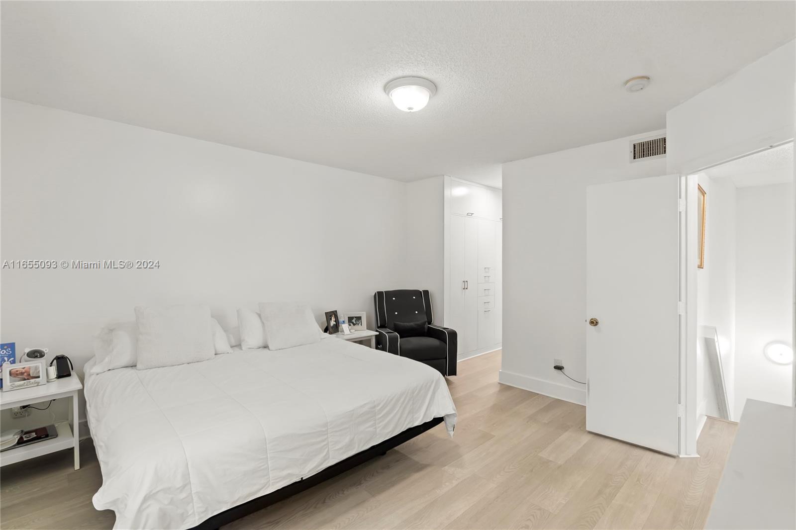 5301 Southwest 126th Terrace, Unit 5301 Miramar, FL 33027 - Photo 23 of 37 a bedroom with a bed and a closet