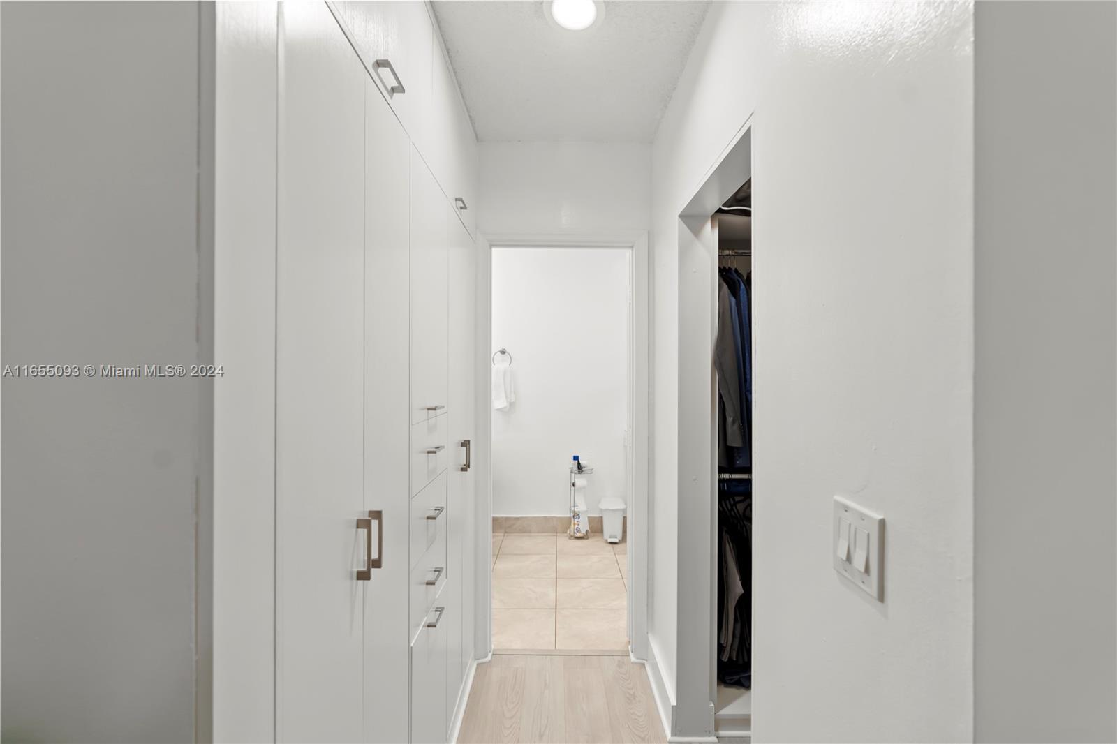 5301 Southwest 126th Terrace, Unit 5301 Miramar, FL 33027 - Photo 24 of 37 a view of a hallway with wooden floor and closet area