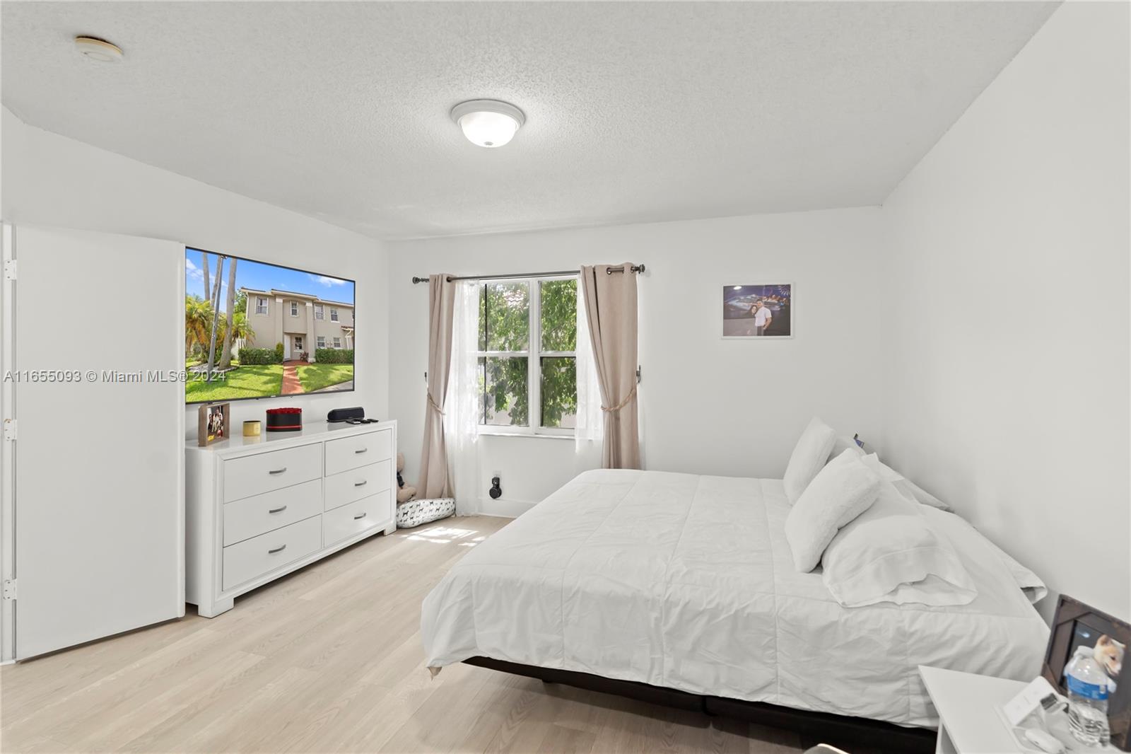 5301 Southwest 126th Terrace, Unit 5301 Miramar, FL 33027 - Photo 25 of 37 a bedroom with a bed and a window