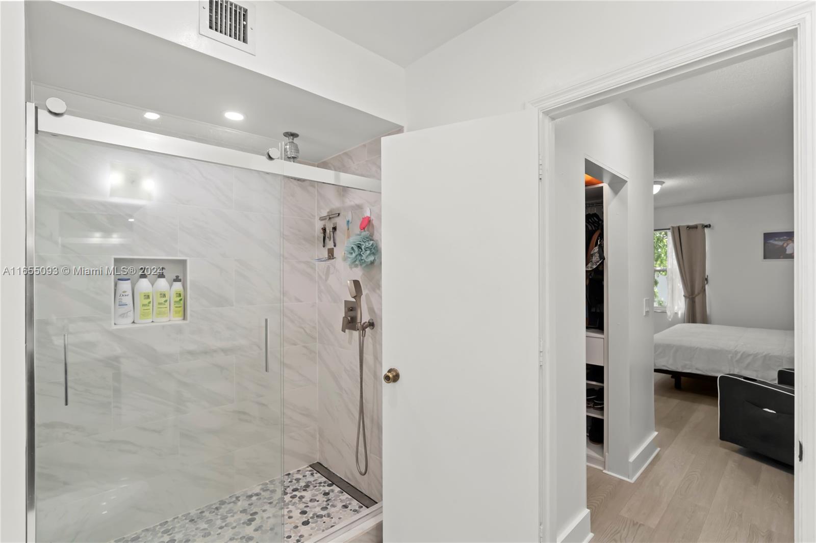 5301 Southwest 126th Terrace, Unit 5301 Miramar, FL 33027 - Photo 28 of 37 a bathroom with a shower